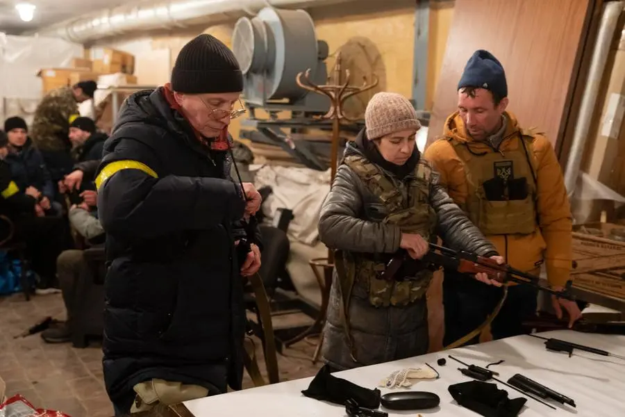 epa09792485 Territorial defense members prepare to patrol in Kiev, Ukraine, 28 February 2022. Russian troops entered Ukraine on 24 February triggering international crisis. EPA/MIKHAIL PALINCHAK