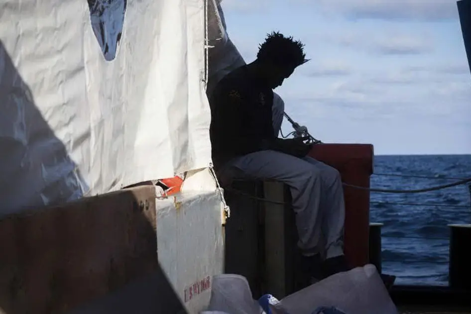 Migranti a bordo della Sea Watch (Ansa)