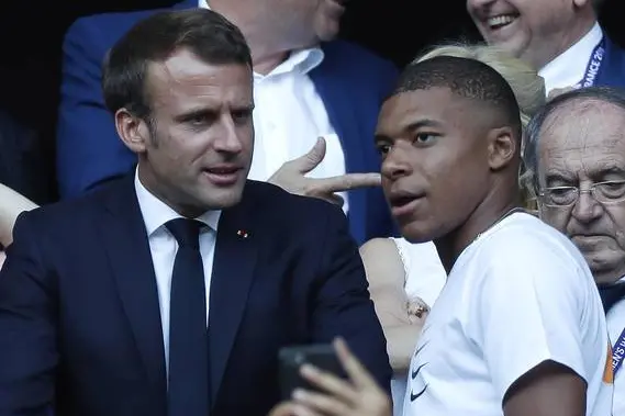 epa07701573 French President Emmanuel Macron (L) and French soccer player Kylian Mbappe (R) during the FIFA Women's World Cup 2019 final soccer match between USA and Netherlands in Lyon, France, 07 July 2019. EPA/IAN LANGSDON