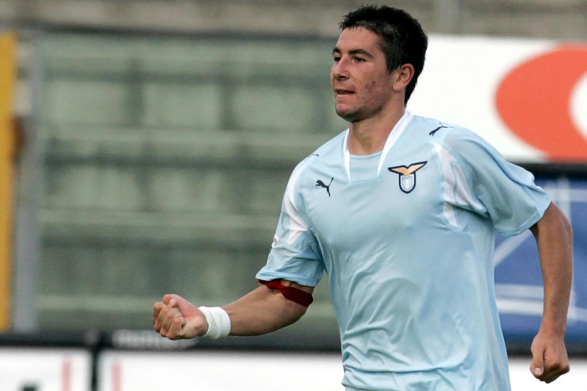 Lazio's defender Aleksandar Kolarov of Serbia Montenegro celebrates after scoring the equalizing goal during the Italian Serie A first division soccer league match between Reggina and Lazio at Reggio Calabria's Oreste Granillo stadium, southern Italy, Sunday, Sept. 30, 2007. The match ended 1-1. Kolarov wears a red arm band in support of the monks in Myanmar and the pro-democracy protests in the country. (AP Photo/Adriana Sapone)