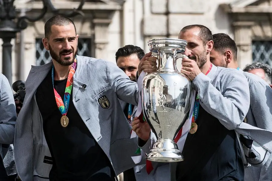 Captain of Italy Giorgio Chiellini with Leonardo Bonucci carries the European Championship trophy to arrive at the Quirinale Palace to be met by Italian President Sergio Mattarella to celebrate the Italy national football team that returned from London after winning the UEFA EURO 2020 championship, Rome, Italy, 12 July 2021. ANSA/ANGELO CARCONI