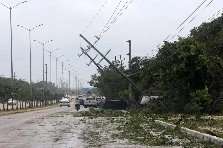 epa09421195 View of downed utility poles during Hurricane Grace in Quintana Roo state, Mexico, 19 August 2021. Hurricane Grace made landfall in the Mexican Caribbean, through the municipality of Tulum, bringing heavy rains. EPA/Alonso Cupul