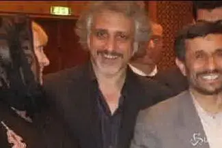 Mario Di Leva, accanto all'ex premier iraniano Ahmadinejad