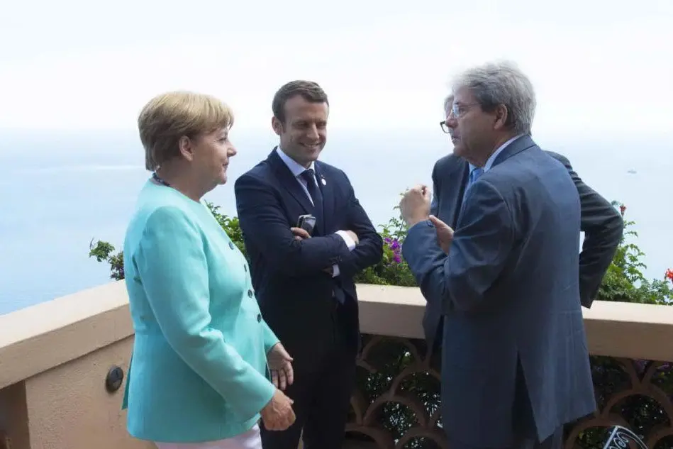 Merkel, Macron e Gentiloni (foto d'archivio)
