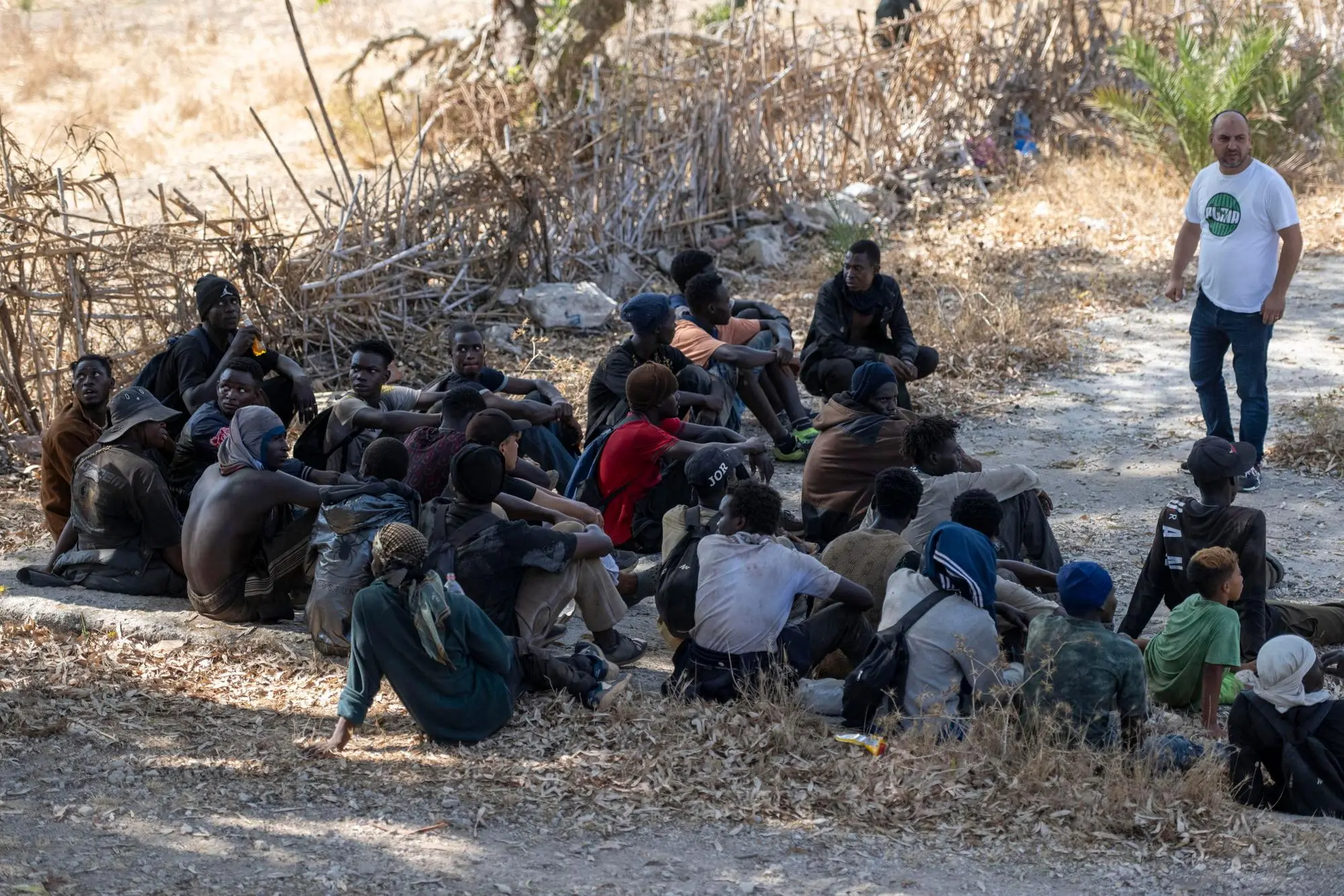 epa13171284 Sub-Saharan African and Sudanese migrants gather in Fnideq as they attempt to enter Ceuta in Fnideq (Castillejos), Morocco, 15 August 2026. Moroccan security sources report that the incident took place in a mountainous area on the outskirts of Castillejos, southwest of Ceuta. EPA/JALAL MORCHIDI
