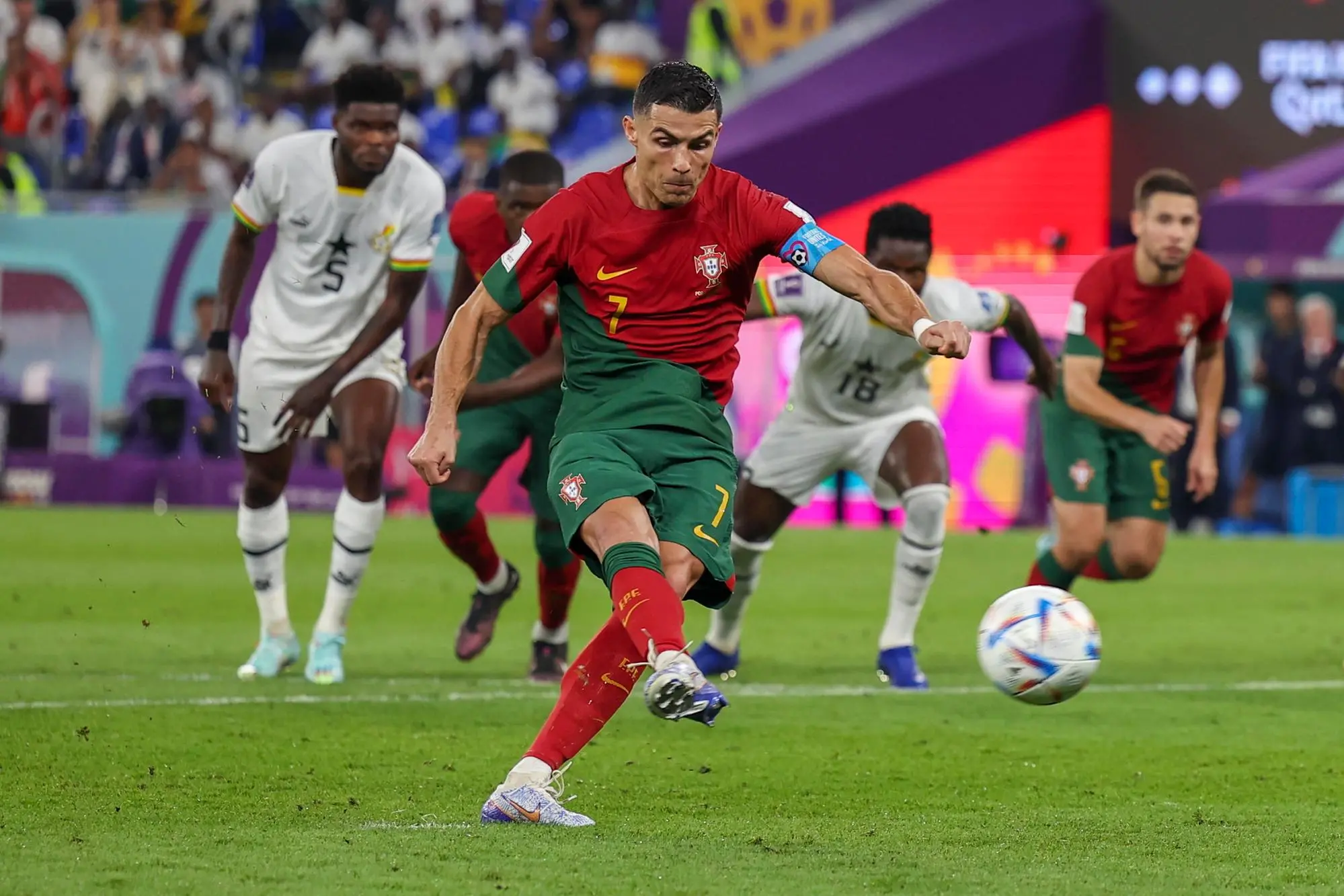 epa10325584 Portugal's Cristiano Ronaldo scores the opening goal with a penalty kick during the FIFA World Cup 2022 group H soccer match between Portugal and Ghana at Stadium 974 in Doha, Qatar, 24 November 2022. EPA/JOSE SENA GOULAO