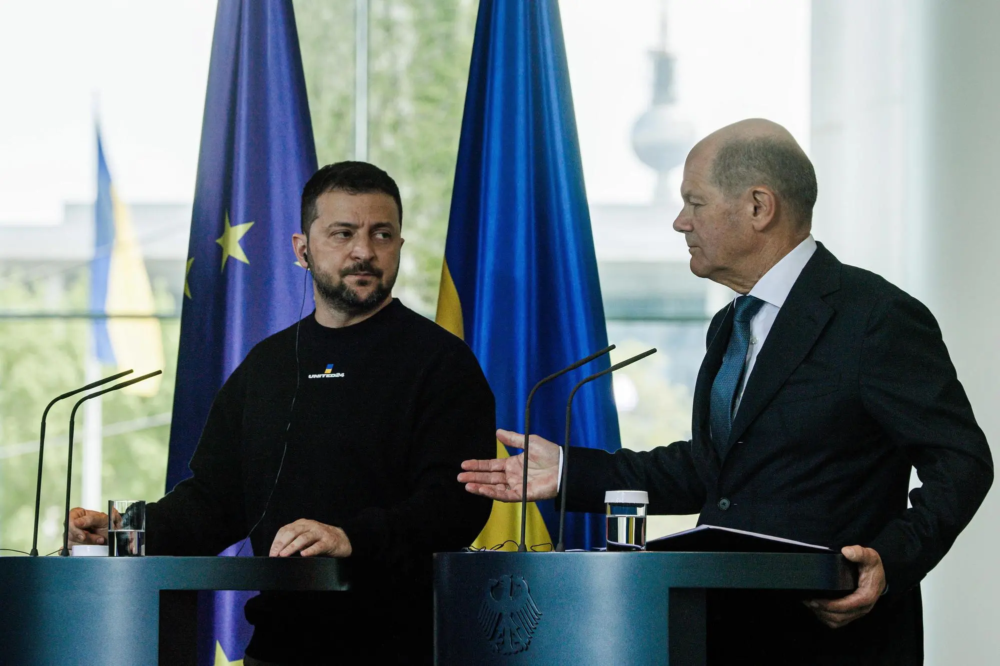 epa10627008 Ukrainian President Volodymyr Zelensky (2-R) and German Chancellor Olaf Scholz (R) address a joint press conference following their meeting at the Chancellery in Berlin, Germany, 14 May 2023. It is the first time Zelensky visits Germany since the start of the Russian invasion of Ukraine in February 2022. EPA/CLEMENS BILAN