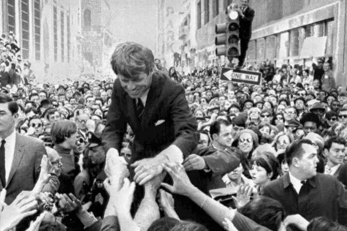 FILE - In this April 2, 1968 file photo U.S. Sen. Robert F. Kennedy, D-NY, shakes hands with people in a crowd while campaigning for the Democratic party's presidential nomination on a street corner, in Philadelphia. Nearly 50 years after Robert F. Kennedy's assassination, a new documentary series on his life and transformation into a liberal hero is coming to Netflix. "Bobby Kennedy for President" produced by RadicalMedia, Trilogy Films and LooksFilm launches Friday, April 27, 2018, on Netflix. (ANSA/AP Photo/Warren Winterbottom, File) [CopyrightNotice: Copyright 2018 The Associated Press. All rights reserved.]