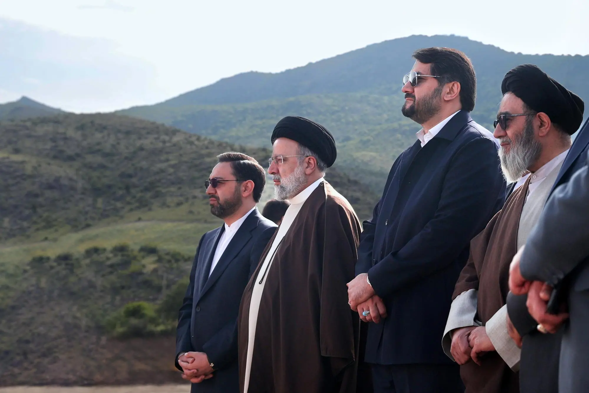 epa11353171 A handout photo made available by the Iranian presidential office shows, Iranian President Ebrahim Raisi (2-L), Iranian road and Urban minister Mehrdad Bazrpash (2-R) at the site of the Iran-Azerbaijan-constructed Qiz-Qalasi dam at the Aras River at the Iran and Azerbaijan shared border in north-western Iran, 19 May 2024. According to Iranian state media, a helicopter carrying Iranian President Ebrahim Raisi has suffered a 'hard landing', giving no further information about the incident. Raisi was returning after an inauguration ceremony of the joint Iran-Azerbaijan-constructed Qiz-Qalasi dam at the Aras River at the Iran and Azerbaijan shared border in north-western Iran. EPA/IRANIAN PRESIDENTIAL OFFICE / HANDOUT HANDOUT EDITORIAL USE ONLY/NO SALES HANDOUT EDITORIAL USE ONLY/NO SALES