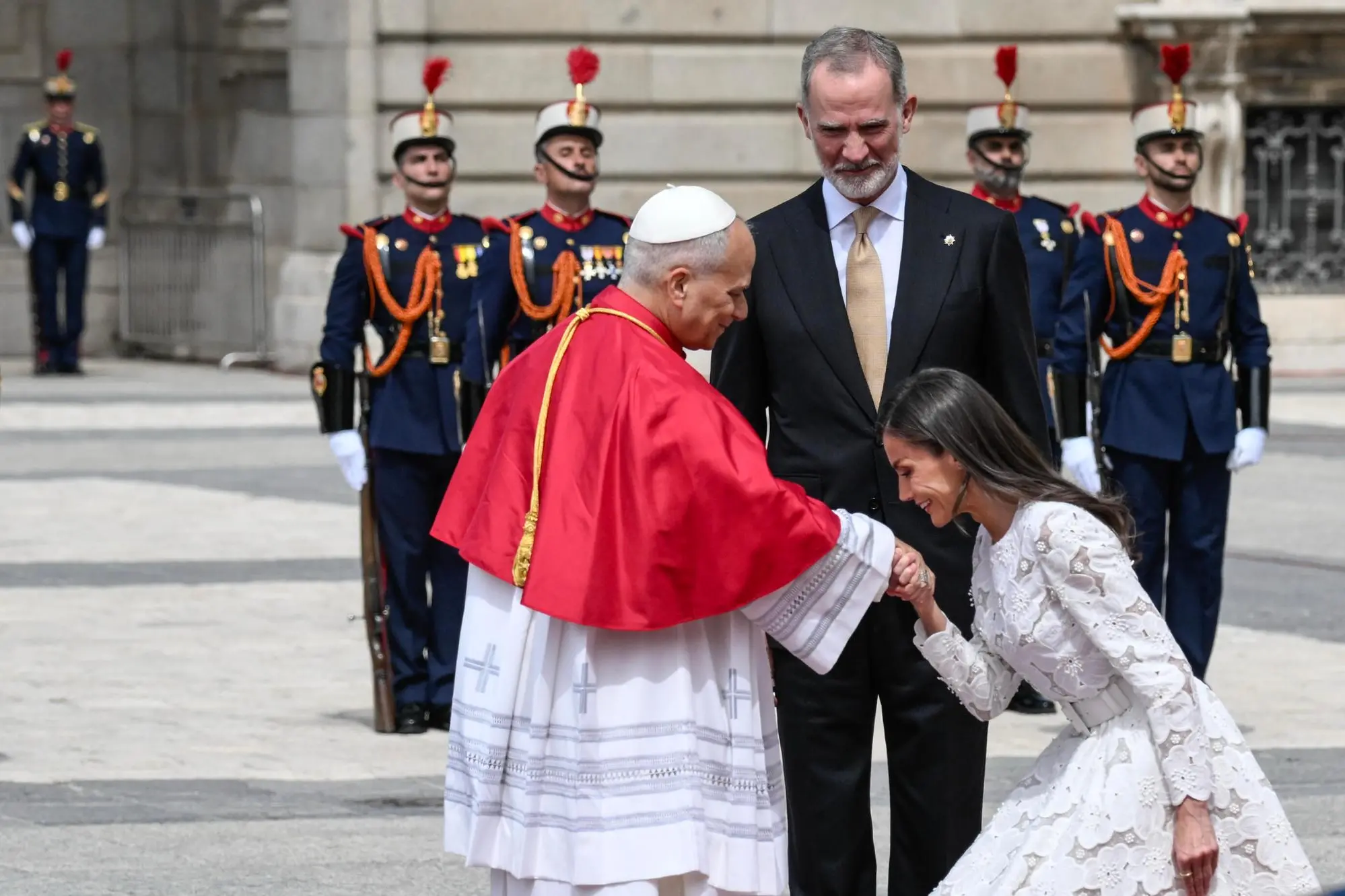 Spain's King Felipe VI (C) and Queen Letizia (R) welcome Pope Leo XIV (C) at the Royal Palace in Madrid, Spain, 06 June 2026. Pope Leo XIV is undertaking an official six-day visit to Spain from 06 to 12 June 2026 covering Madrid, Barcelona, and the Canary Islands. ANSA/CIRO FUSCO