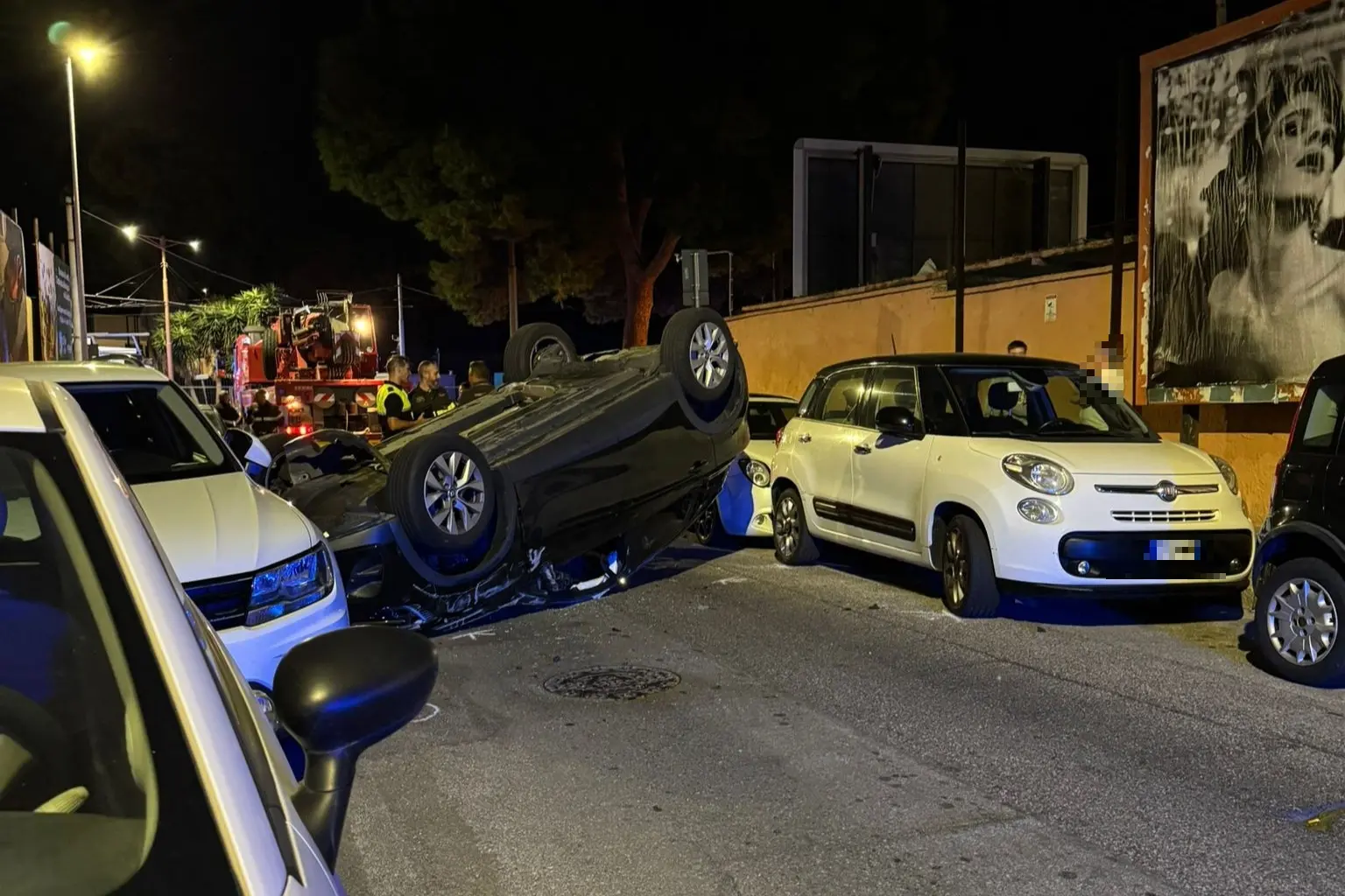 L'auto ribaltata in via Goceano (foto Scano)