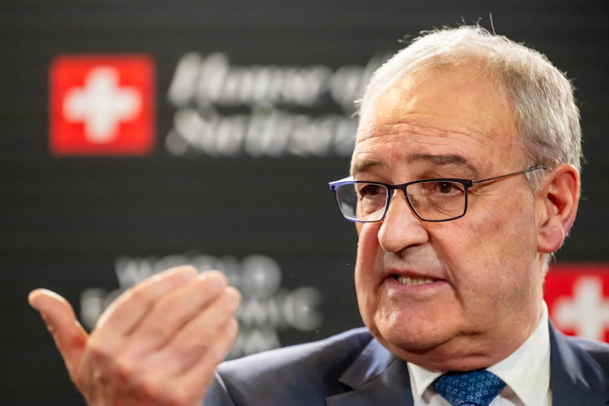 epa12664820 Switzerland's Federal President Guy Parmelin speaks during a press conference at the House of Switzerland (HoS), on the sideline of the 56th annual meeting of the World Economic Forum (WEF) in Davos, Switzerland, 20 January 2026. The 2026 summit, running from 19 to 23 January and held under the theme 'A Spirit of Dialogue,' brings together global political leaders, corporate executives, and scientists to address international challenges. EPA/LAURENT GILLIERON / POOL