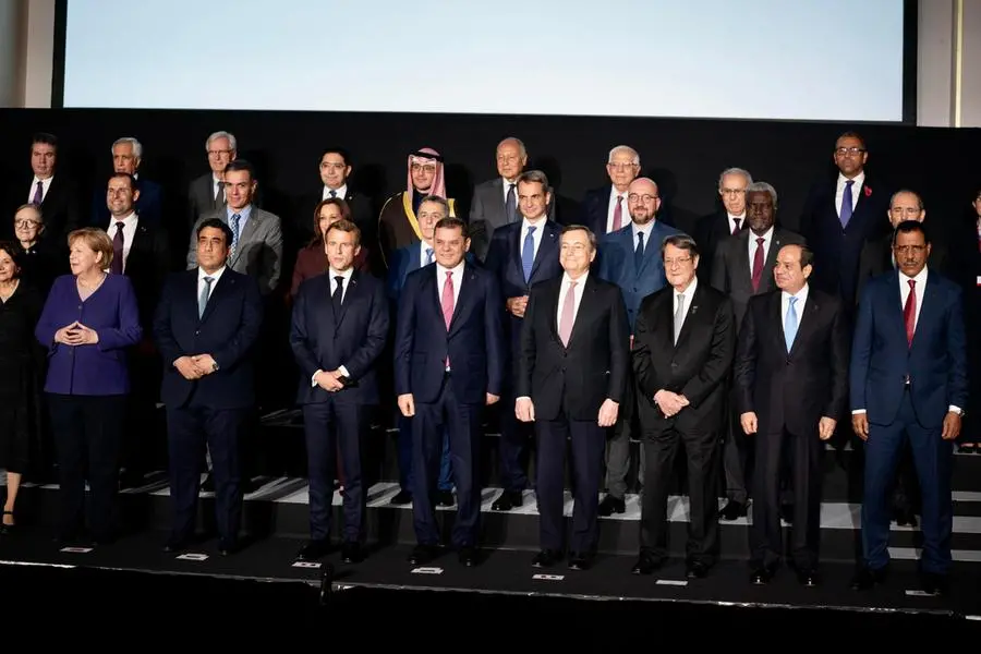 Il presidente del Consiglio Mario Draghi durante la 'photo family' in occasione del vertice internazionale sulla Libia (Ansa)