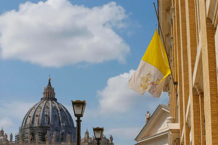 Vatican flag fly at half-staff during commemorating the coronavirus victims, near San Peter square, Rome 31 March, 2020. ANSA / FABIO FRUSTACI