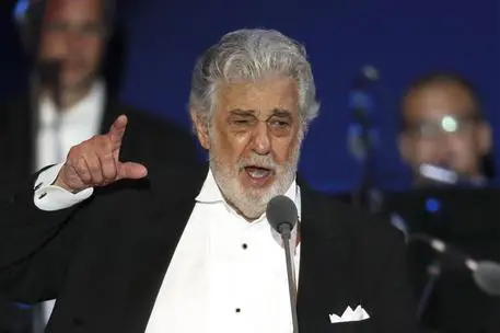 FILE- In this Aug. 28, 2019, file photo, opera star Placido Domingo performs during a concert in Szeged, Hungary. The Tokyo Olympics organizing committee has not decided what it plans to do about the appearance of Placido Domingo at a 2020 Games event and is looking into reports of sexual harassment by the opera star. (ANSA/AP Photo/Laszlo Balogh, File) [CopyrightNotice: Copyright 2018 The Associated Press. All rights reserved]