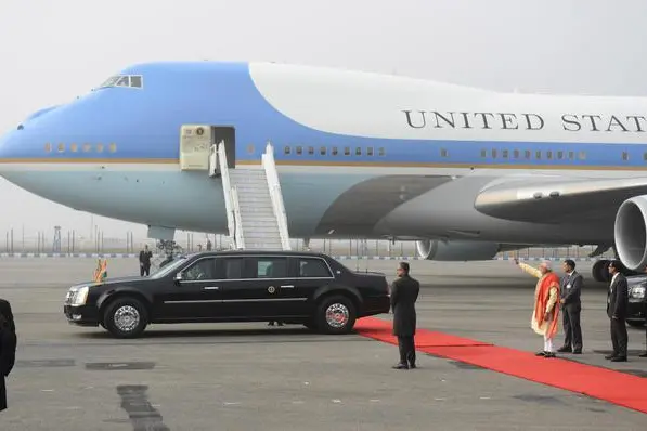 Indian Prime Minister Narendra Modi waves as the car carrying U.S. President Barack Obama and first lady Michelle Obama drive off at the Palam Air Force Station in New Delhi, India, Sunday, Jan. 25, 2015. Obama's arrival Sunday morning in the bustling capital of New Delhi marked the first time an American leader has visited India twice during his presidency. Obama is also the first to be invited to attend India's Republic Day festivities, which commence Monday and mark the anniversary of the enactment of the country's democratic constitution. (ANSA/AP Photo)