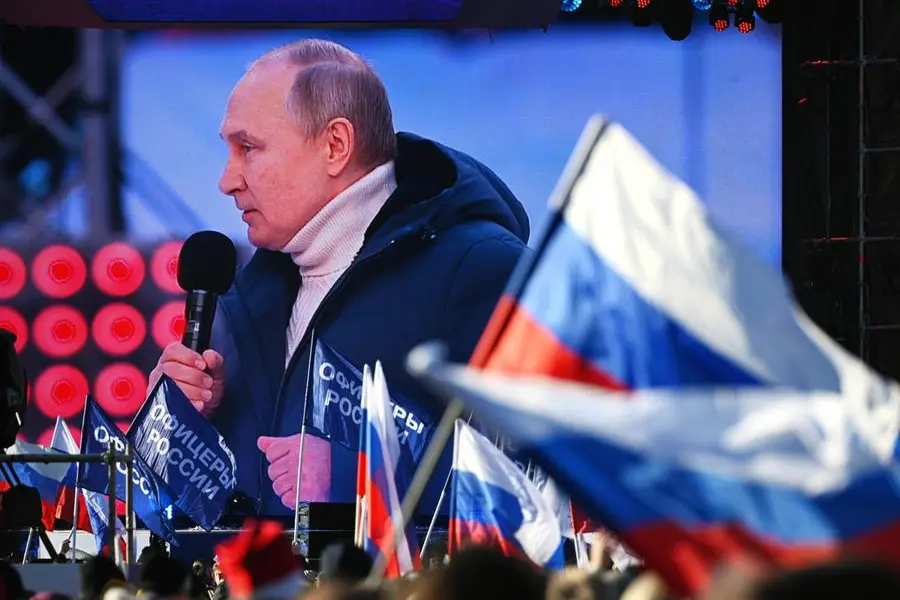 epa09833705 A screen shows Russian President Vladimir Putin delivering a speech during a concert marking the 8th anniversary of Crimea's reunification with Russia at the Luzhniki stadium in Moscow, Russia, 18 March 2022. Russia in 2014 annexed the Black Sea peninsula, shortly after Crimeans voted in a disputed referendum to secede from Ukraine. EPA/VLADIMIR ASTAPKOVICH / SPUTNIK / POOL MANDATORY CREDIT