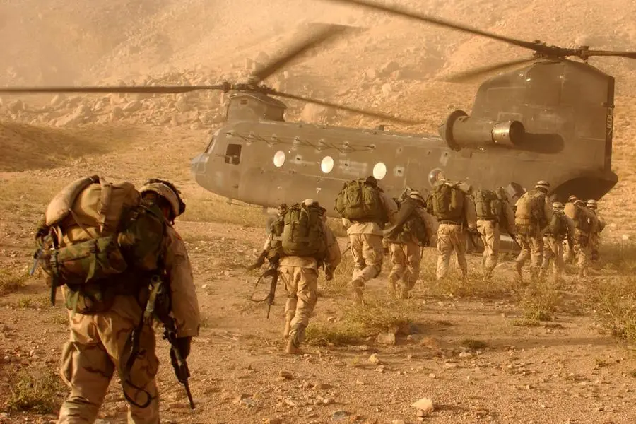 Operation Mountain Viper put the soldiers of A Company, 2nd Battalion 22nd Infantry Division, 10th Mountain in the Afghanistan province of Daychopan to search for Taliban and or weapon caches that could be used against U.S. and allied forces. Soldiers quickly walk to the ramp of the CH-47 Chinook cargo helicopter that will return them to Kandahar Army Air Field. (U.S. Army photo by Staff Sgt. Kyle Davis) (Released)