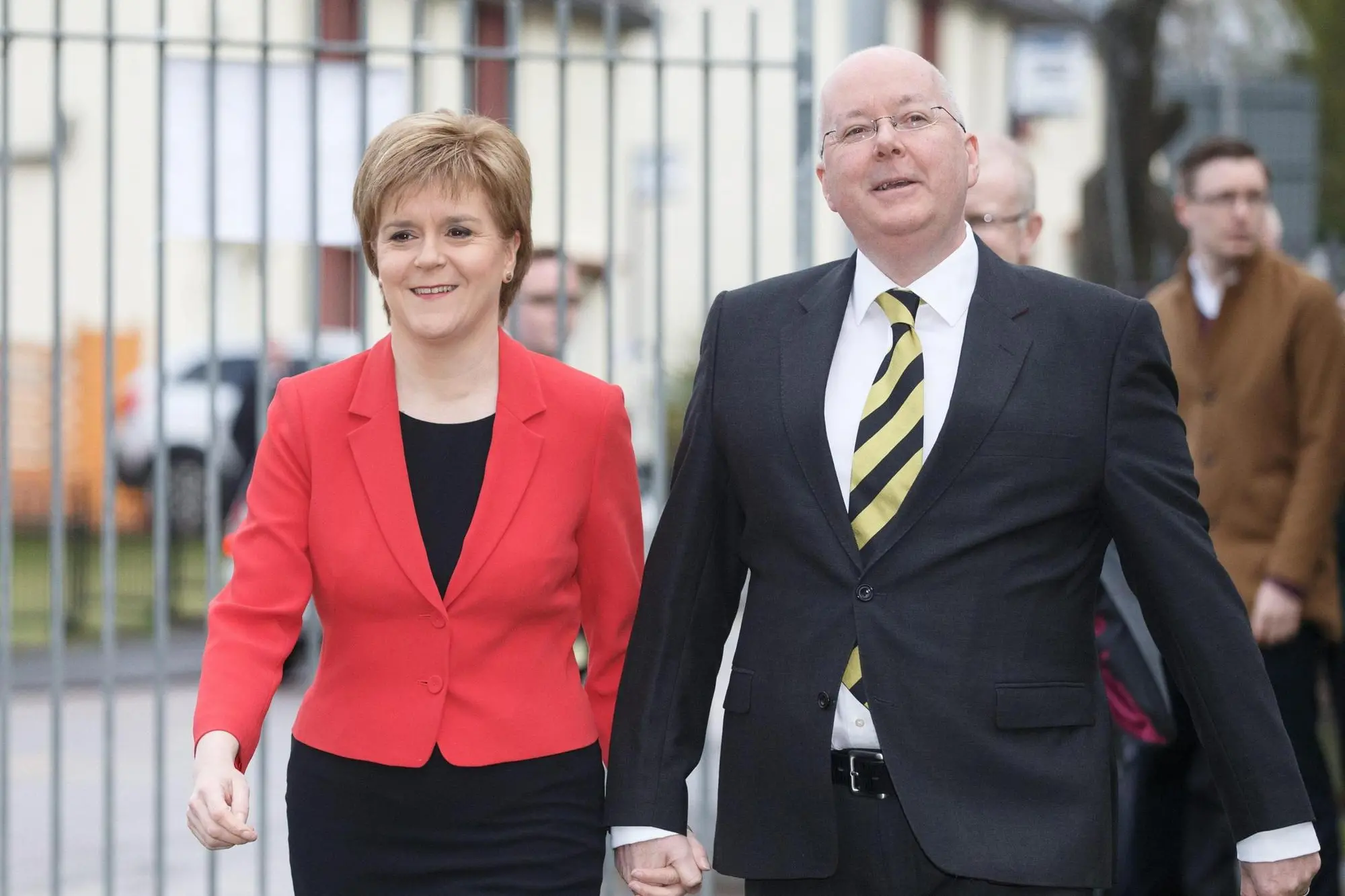 SNP Leader Nicola Sturgeon (L) arrives with her husband Peter Murrell (R), current CEO of the SNP, to cast her vote in the Scottish Parliamentary election, at Broomhoouse Community Hall in Glasgow, Scotland, 05 May 2016. ANSA/ROBERT PERRY