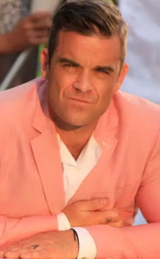 Sul set del video di &quot;Candy&quot; nel 2012 (foto Wikipedia e archivio L'Unione Sarda)