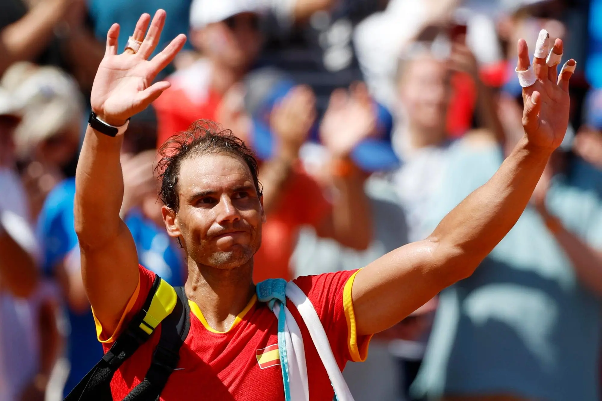 epa11652220 epa11652016 (FILE) - Rafael Nadal of Spain waves to the spectators after losing the Men's Singles second round match against Novak Djokovic of Serbia at the Tennis competitions in the Paris 2024 Olympic Games, at the Roland Garros in Paris, France, 29 July 2024 (reissued 10 October 2024). On 10 October 2024, Rafael Nadal of Spain announced that he will retire from professional tennis. Since winning his first ever title in 2004, Nadal won 92 titles, including 22 grand slams and a record 14 French Open titles. EPA/FRANCK ROBICHON