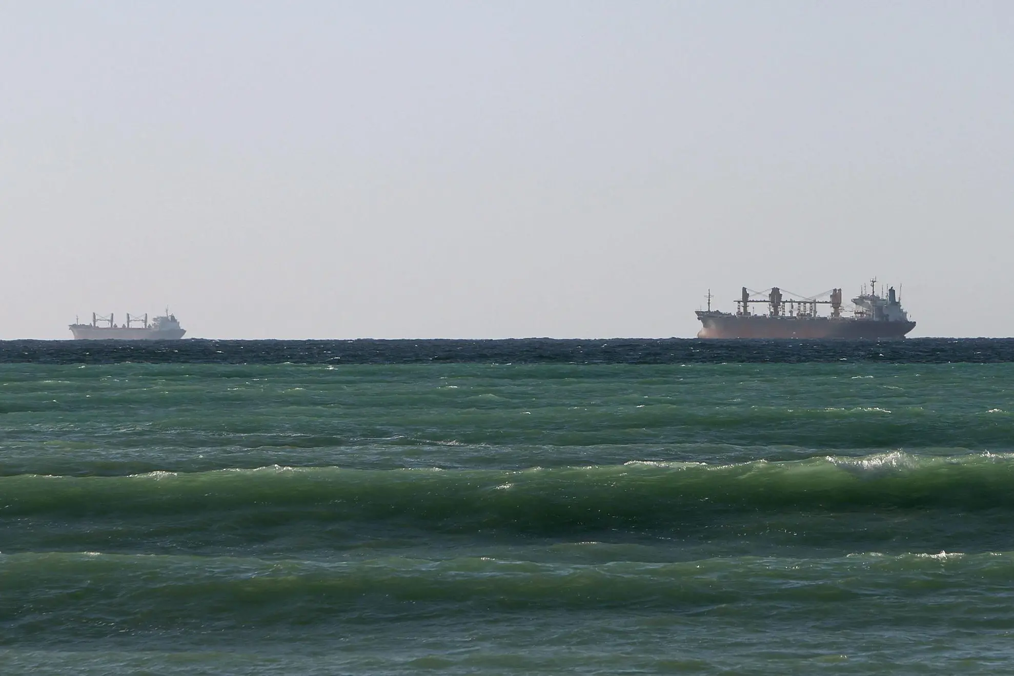 epa03060767 Oil ships are seen in Tibat at one of Strait of Hormuz ends, Oman, 15 January 2012. Iranian generals have recently threatened to close the Strait of Hormuz - a vital international oil shipping route in the Gulf - if oil sanctions are imposed against the Islamic state. The United States issued counter-warnings of decisively confronting such a move. The people living in Khasab and other cities at Strait of Hormuz complained that they will lose their jobs depending on tourists and fishing the strait was closed. EPA/ALI HAIDER