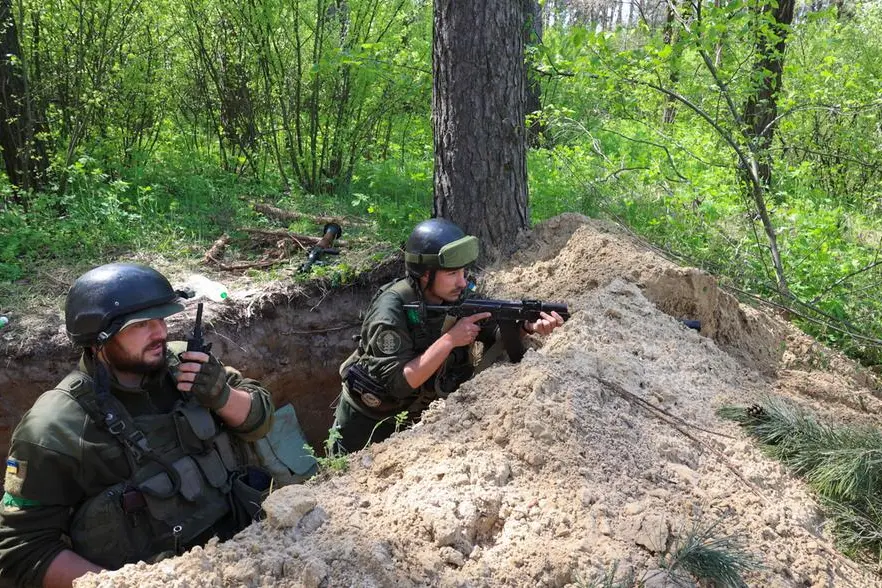 epa09918800 Ukrainian National Guard fighters attend a training before they are sent to a front line near of Kharkiv, Ukraine, 30 April 2022. Russian troops entered Ukraine on 24 February resulting in fighting and destruction in the country and triggering a series of severe economic sanctions on Russia by Western countries. EPA/SERGEY KOZLOV