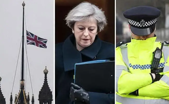 La bandiera a mezz'asta il giorno dopo l'attacco, Theresa May e un poliziotto