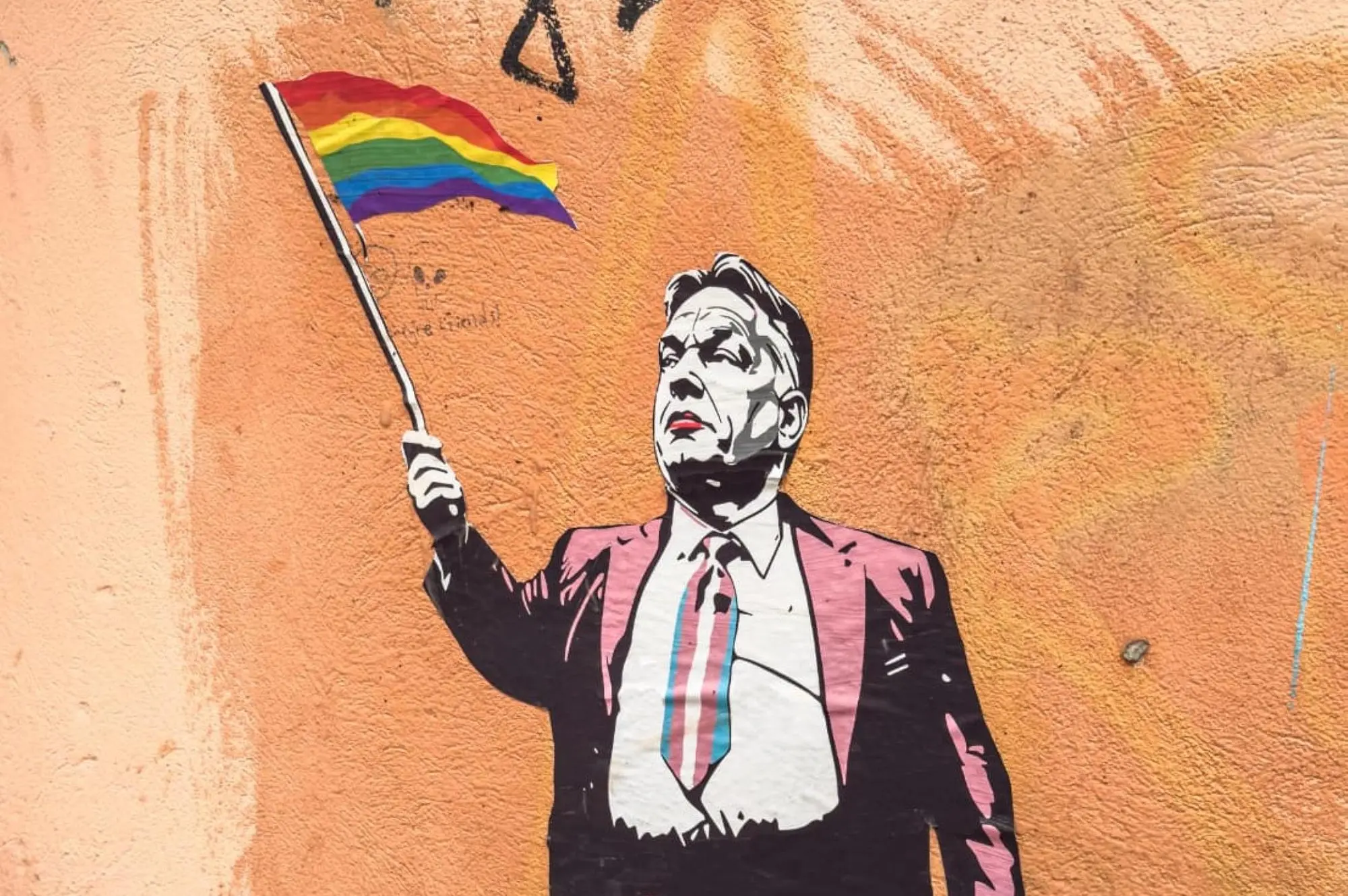 Budapet, poster di Laika con Orban in versione queer e con bandiera arcobaleno