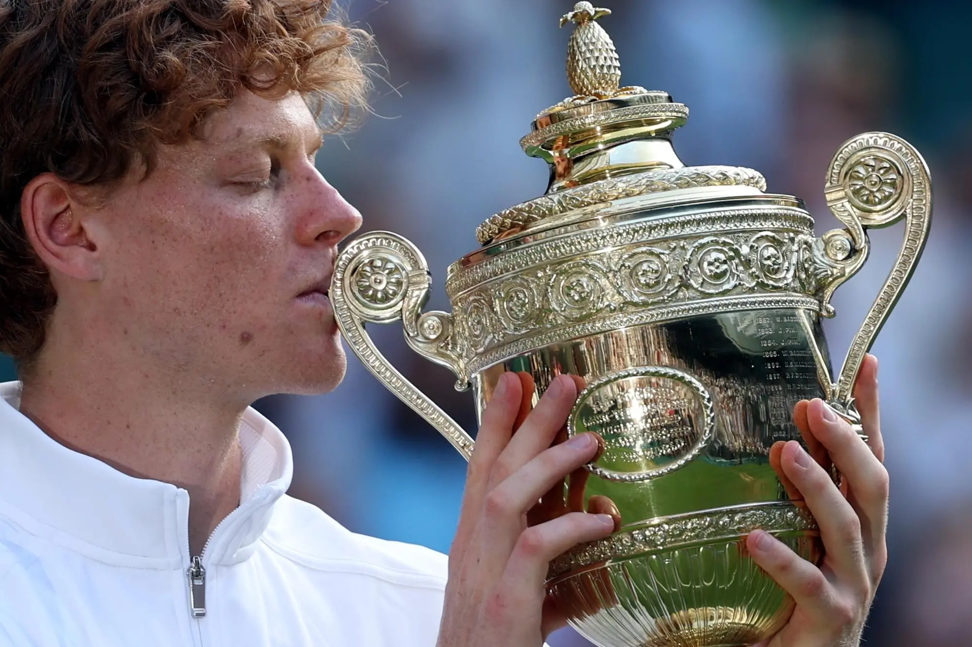 epa12236190 Jannik Sinner of Italy celebrates with the trophy after winning the Men's Singles final match against Carlos Alcaraz of Spain at the Wimbledon Championships, Wimbledon, Britain, 13 July 2025. EPA/NEIL HALL EDITORIAL USE ONLY