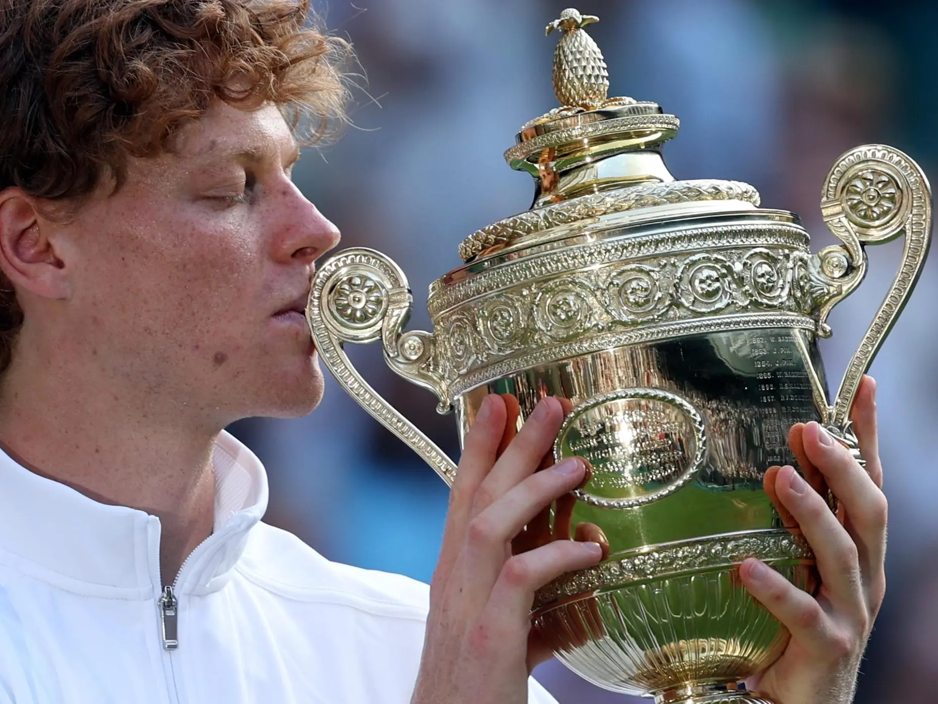 epa12236190 Jannik Sinner of Italy celebrates with the trophy after winning the Men's Singles final match against Carlos Alcaraz of Spain at the Wimbledon Championships, Wimbledon, Britain, 13 July 2025. EPA/NEIL HALL EDITORIAL USE ONLY