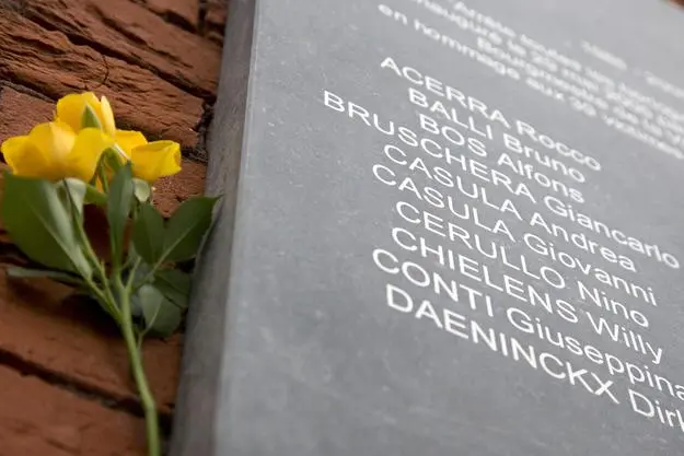 Flowers are left at a memorial plaque during a commemoration at the King Boudouin (formerly the Heysel) Stadium in Brussels on Friday, May 29, 2015. Friday marks 30 years since 39 victims lost their lives during a European Cup football match between Liverpool and Juventus due to a surge of rival supporters resulting in a collapsed wall. (ANSA/AP Photo/Virginia Mayo)
