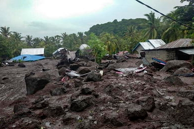 epa09114964 A handout photo made available by the Indonesian National Board for Disaster Management (BNPB) shows a general view over a flash flood aftermath at village in East Flores, Indonesia, 04 April 2021. According to the BNPB, at least 23 people were killed and some others are missing after the flash floods. EPA/BNPB HANDOUT HANDOUT EDITORIAL USE ONLY/NO SALES