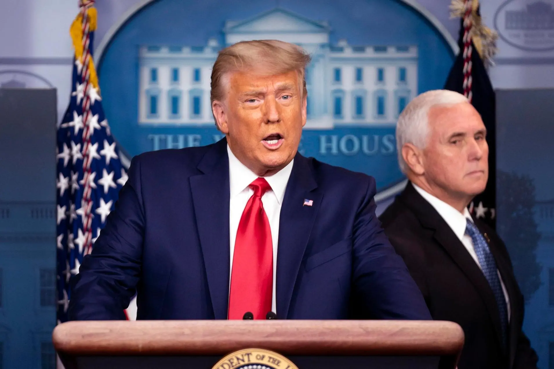 epa08839525 US President Donald J. Trump joined by Vice President Mike Pence (R), delivers brief remarks on the stock market and the Dow reaching 30,000 for the first time in history, at the White House in Washington, DC, USA, 24 November 2020. EPA/KEVIN DIETSCH / POOL