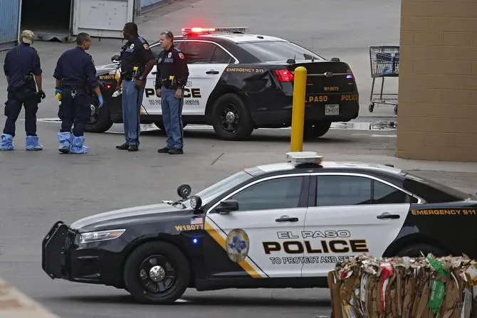 epa07759358 Police stand outside while investigating the mass shooting that happened at a Walmart in El Paso, Texas, USA, 06 August 2019. Twenty two people killed and over forty injured from the mass shooting at the Walmart in El Paso, Texas on 03 August 2019. EPA/LARRY W. SMITH