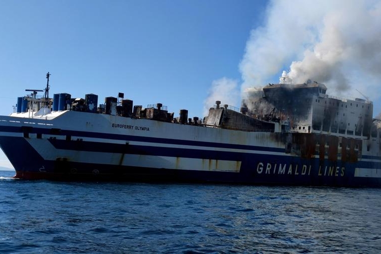 Firefighting forces continue their battle against pockets of fire and extremely high temperatures on the burning ferry 'Euroferry Olympia' after a fire that broke out onboard while sailing off Ereikousa island, Ionian Sea, Greece, 19 February 2022. The Greek Fire Brigade's special disaster unit (EMAK) said they will not be able to search for the 12 people still missing, among them 3 Greek nationals, unless smoke and high temperatures subside, as these can reach up to 500C in some parts of the ferry. Firefighters were trying to put out the fire operating from onboard the tug boats and the fire brigade's firefighting vessel. A total of 280 passengers and crew have been evacuated, including two foreign nationals who were not on the passenger list, while another 12 cannot be accounted for. The fire broke out on 18 February as the ferry was sailing off Erikoussa, near Corfu, while carrying out the journey from Igoumenitsa to the port of Brindisi in Italy. ANSA/STR