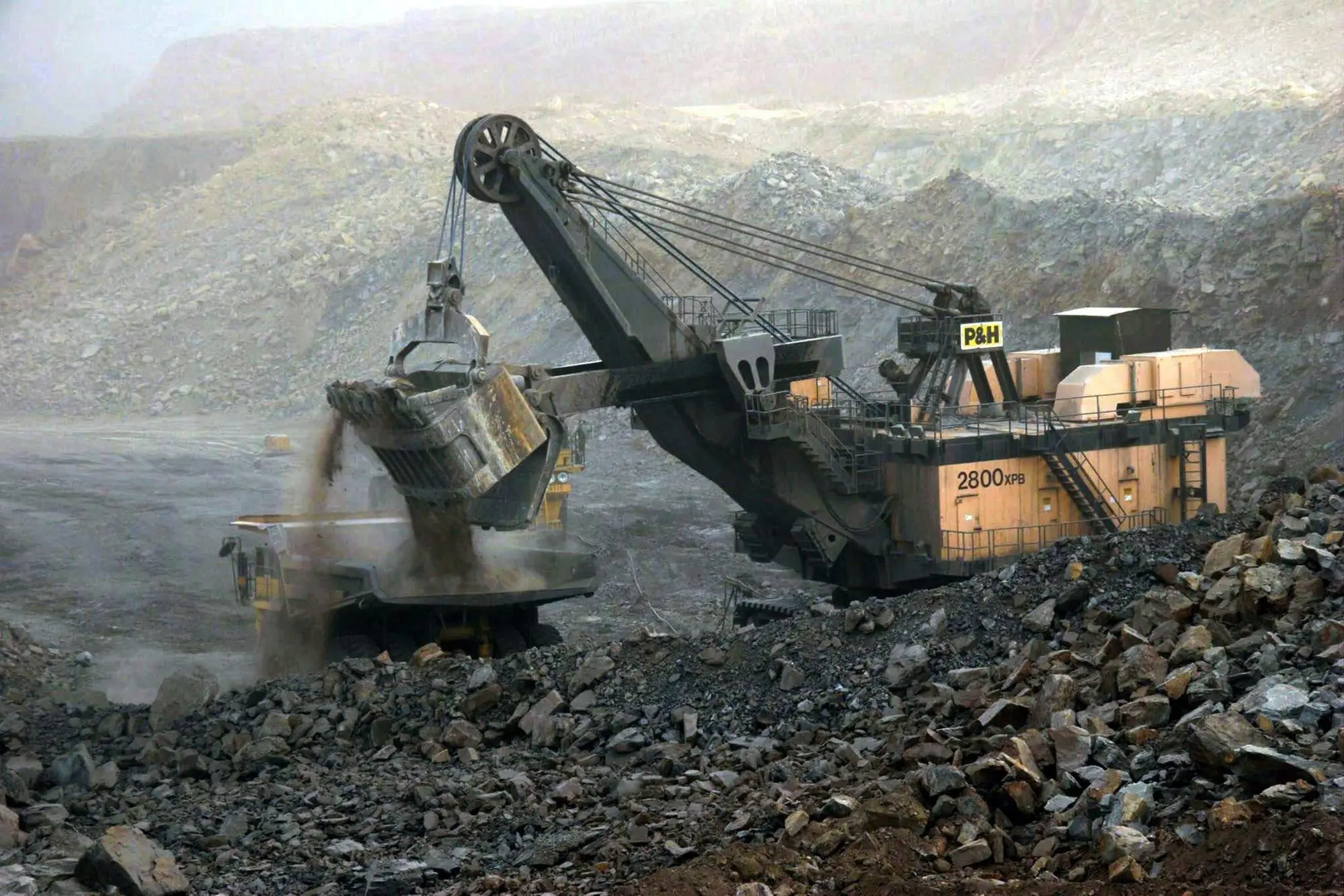 epa03086902 (FILE) A file photo dated 07 July 2005 showing an earth digger dumping dirt on to a large truck at the Antaibao open-air coal mine near Shuozhou, Shanxi Province, China. Geneva-based World Trade Organization (WTO) dismissed a Chinese appeal on 30 January 2012 and upheld its decision that Beijings practice of limiting certain raw materials including magnesium should end. Western countries that won the trade dispute over Chinese export restrictions on industrial raw materials, have already set their sights on a new goal: prying open Beijing's restrictive policies on rare earths. However, China is unlikely to budge on these minerals, now sought after by high-tech industries, unless there is a specific new ruling by the World Trade Organization (WTO), expert Jaakko Kooroshy said 31 January 2012. EPA/QILAI SHEN