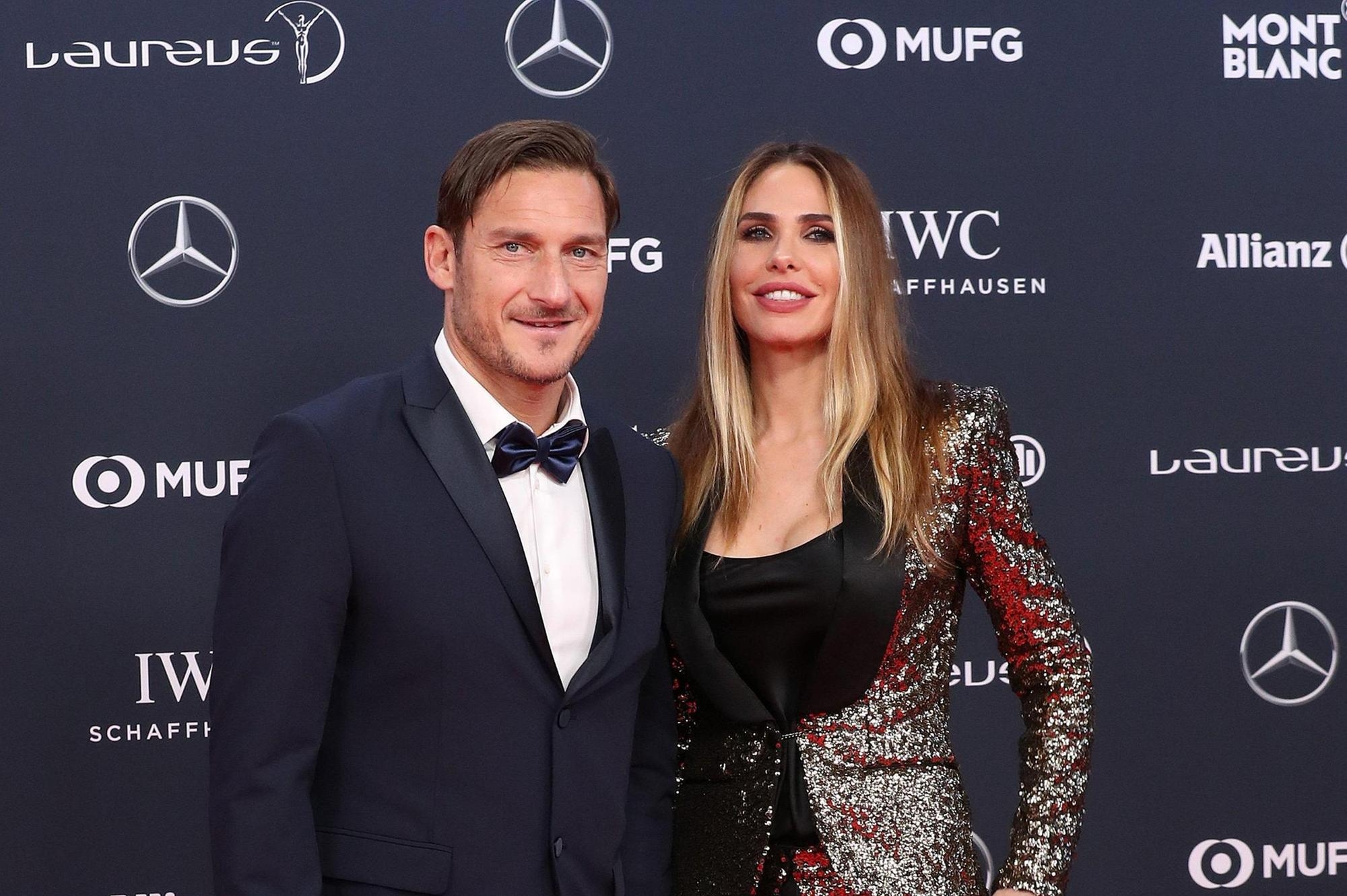 epa06569287 Former Italian soccer player Francesco Totti (L) and his wife Ilary Blasi (R) arrive at the 2018 Laureus World Sports Awards in Monaco, 27 February 2018. The annual Laureus Awards are held to honor people whom make a notable impact and remarkable accomplishments in the world of sport throughout the year. EPA/SEBASTIEN NOGIER