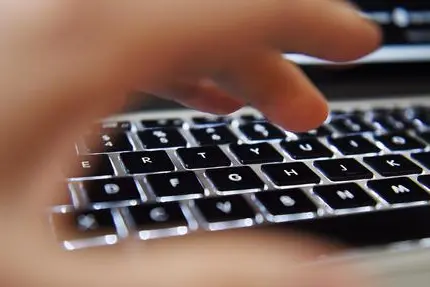 epa04605760 A hand operates above a laptop's keyboard in London, Britain, 06 February 2015. The Investigatory Power Tribunal on 06 February 2015 ruled, that Britain's intelligence agency GCHQ sharing private communications of UK residents with US authorities was contravening Articles from the European Court of Human Rights (ECHR) but now complies. EPA/ANDY RAIN
