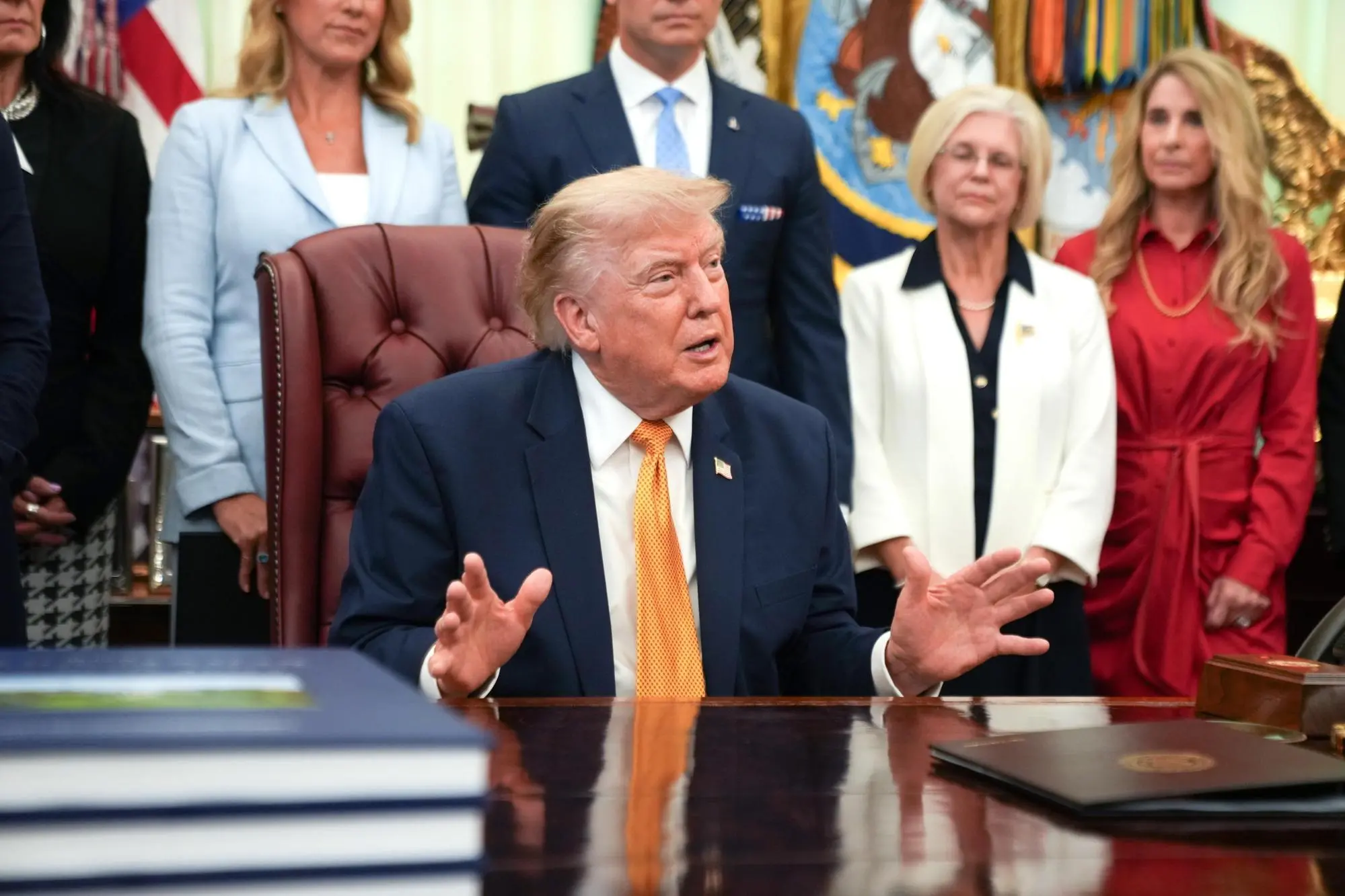 epa13148901 US President Donald Trump announces an executive order establishing the Presidential Military Spouse Commission, in the Oval Office at the White House in Washington, DC, USA, 03 August 2026. EPA/Allison Robbert / POOL