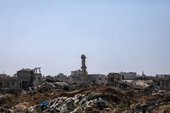 epa11327579 Damaged mosque and houses near Salah Al Din road between Khan Younis town and Rafah, southern Gaza Strip, 08 May 2024. The Israel Defence Forces (IDF) on 06 May called on residents of eastern Rafah to 'temporarily' evacuate to an expanded humanitarian area. On 07 May the IDF stated that its ground troops began an overnight operation targeting Hamas militants and infrastructure within specific areas of eastern Rafah, taking operational control of the Gazan side of the Rafah crossing based on intelligence information. More than 34,600 Palestinians and over 1,455 Israelis have been killed, according to the Palestinian Health Ministry and the IDF, since Hamas militants launched an attack against Israel from the Gaza Strip on 07 October 2023, and the Israeli operations in Gaza and the West Bank which followed it. EPA/MOHAMMED SABER