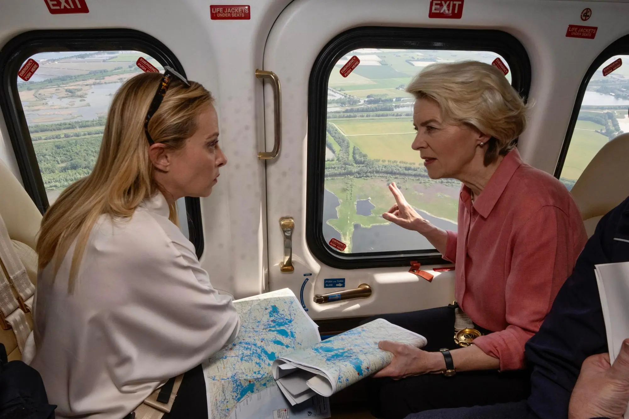 epa10653781 A handout picture made available by the Chigi Palace (Palazzo Chigi) Press Office shows Italian Prime Minister Giorgia Meloni (L) with President of the European Commission Ursula Von Der Leyen during an aerial reconnaissance of the areas of Emilia-Romagna region affected by floods, landslides and mudslides, northern Italy, 25 May 2023. The European Commission President said she visited Emilia-Romagna to show that the region and Italy have the EU's full support after last week's devastating floods that claimed 15 lives. EPA/FILIPPO ATTILI/CHIGI PALACE PRESS OFFICE HANDOUT HANDOUT EDITORIAL USE ONLY/NO SALES