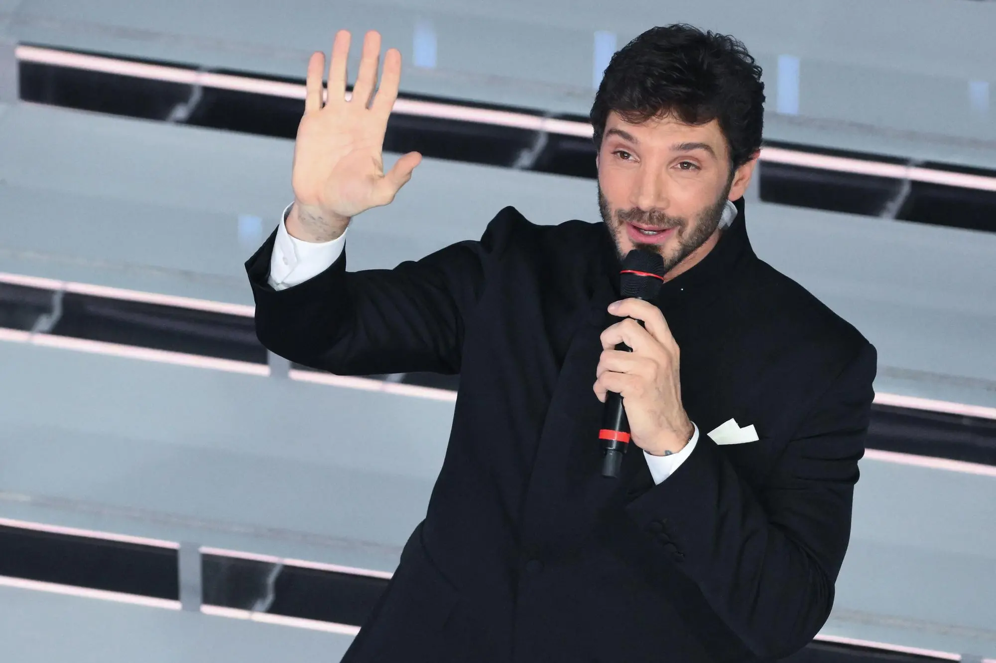 (L-R) Sanremo Festival host and artistic director Carlo Conti with Italian TV presenter Stefano De Martino on stage at the Ariston theatre during the 76th edition of the Sanremo Italian Song Festival, in Sanremo, Italy, 28 February 2026. The Music Festival runs from 24 to 28 February 2026. ANSA/ETTORE FERRARI