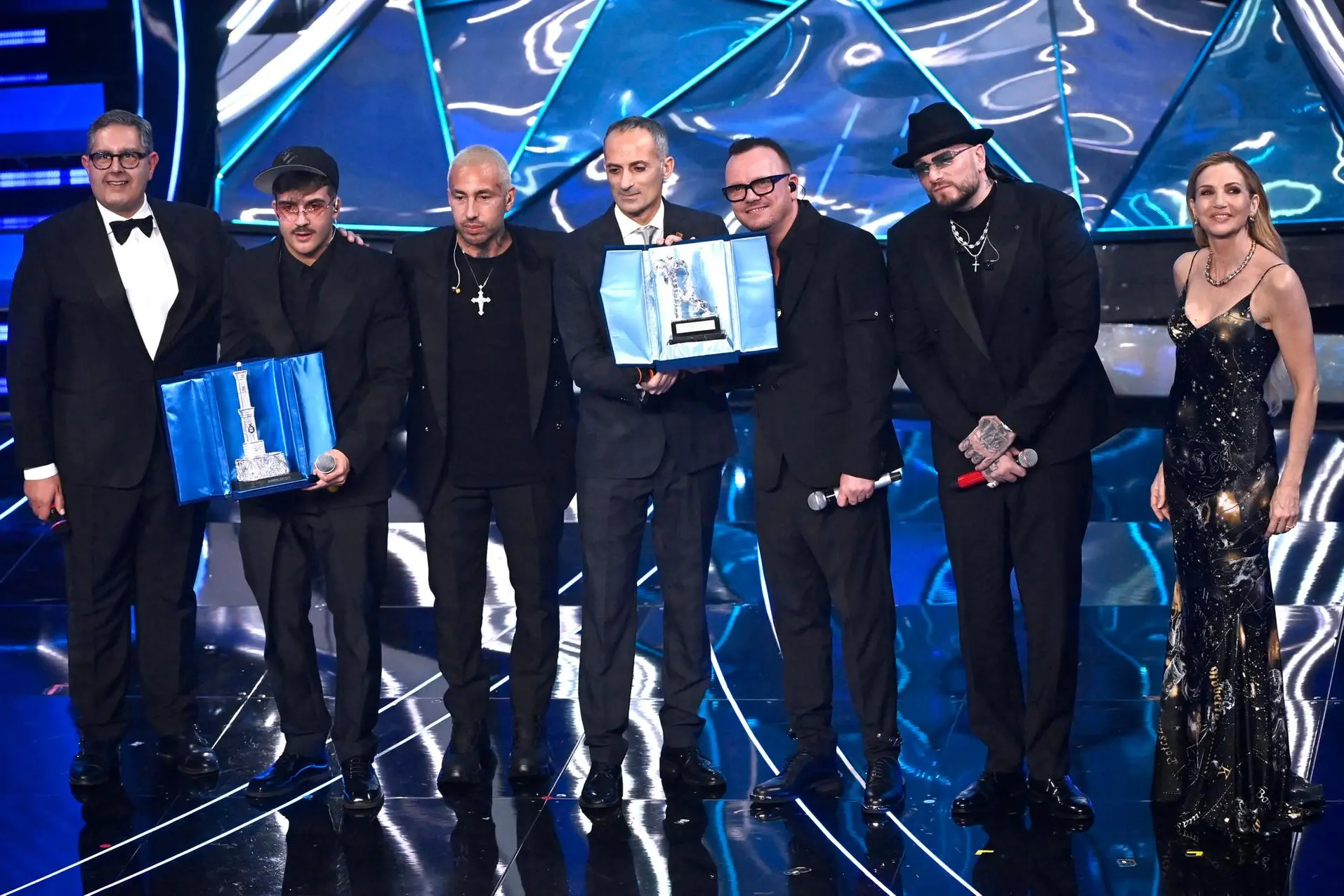 Italian singers Geolier, Guè, Luchè and Gigi D'Alessio celebrate on stage after winning a trophy for the Best Cover at the Ariston theatre during the 74th Sanremo Italian Song Festival, Sanremo, Italy, 09 February 2024. The music festival will run from 06 to 10 February 2024. ANSA/RICCARDO ANTIMIANI