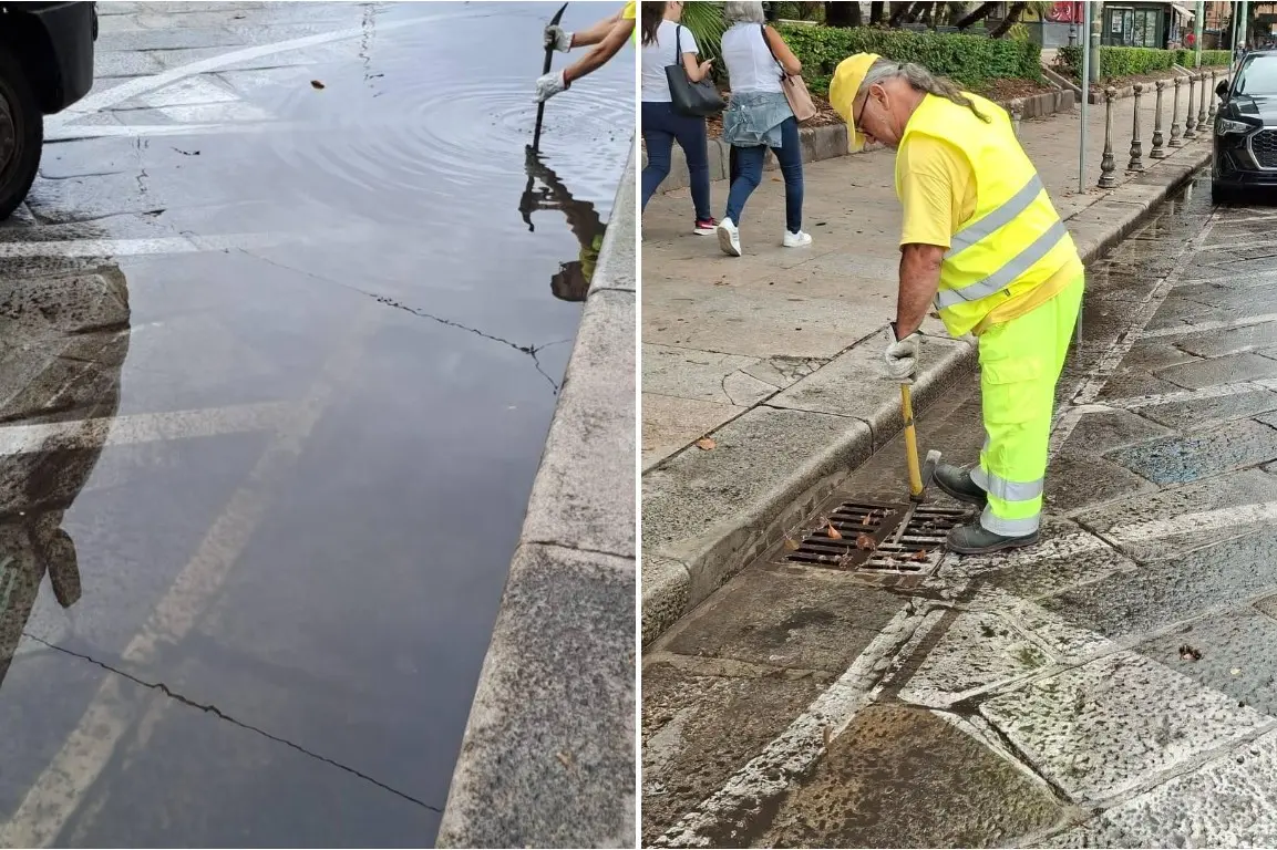 Operai al lavoro in via Roma