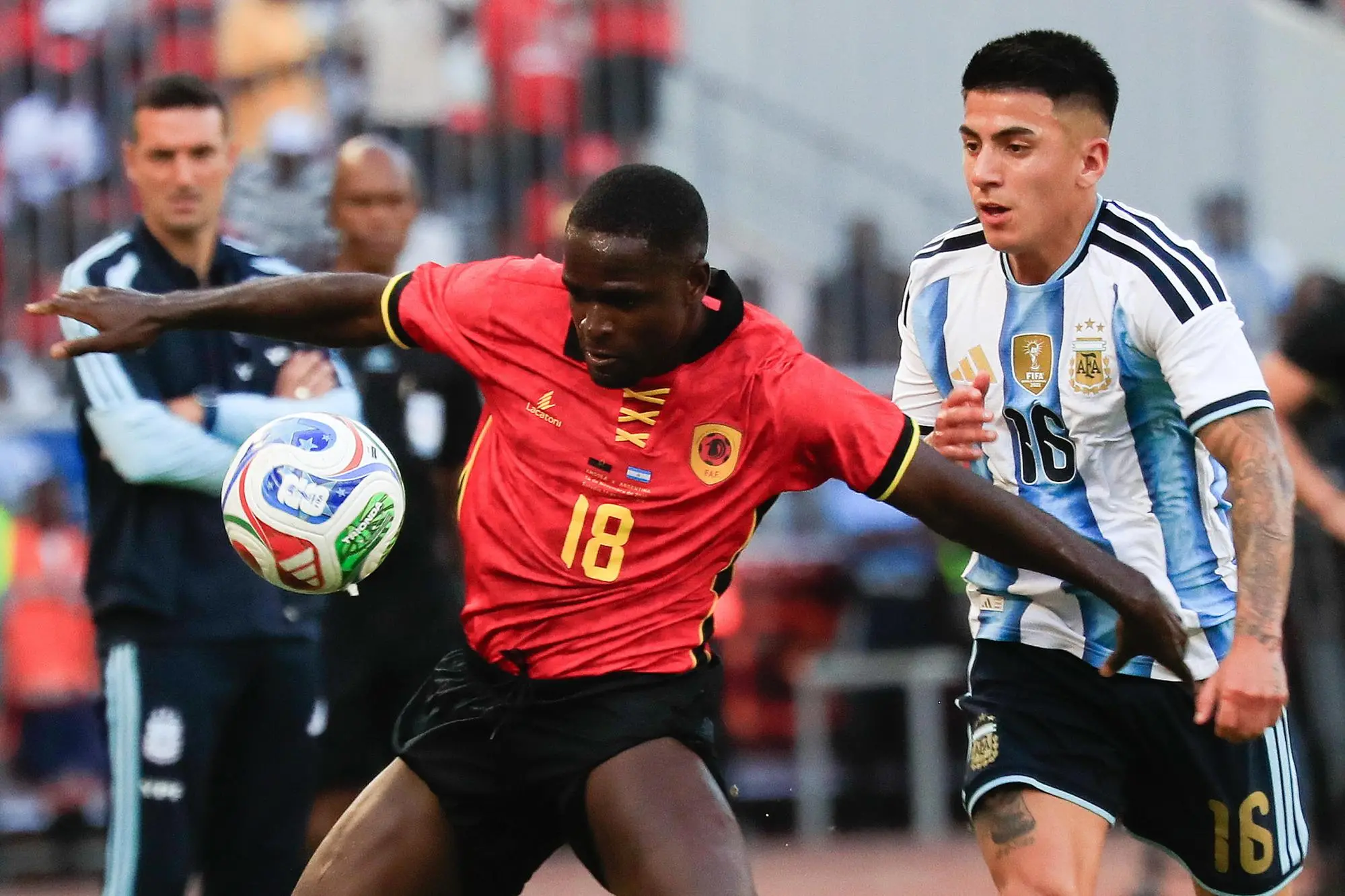 epa12526823 Argentina's Thiago Almada (R) in action against Angola's Zito Luvumbo during the international friendly soccer match between Angola and Argentina at the National Stadium in Luanda, Angola, 14 November 2025. EPA/AMPE ROGERIO
