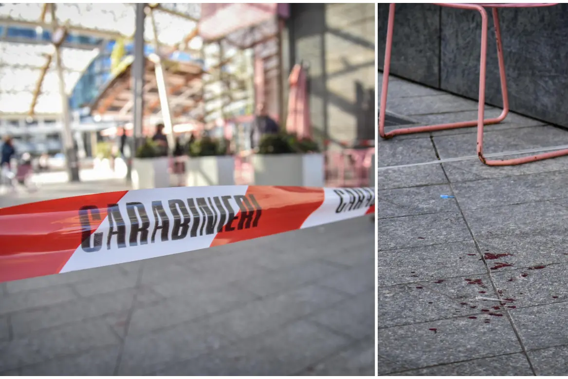 Milano, rilievi dei carabinieri in corso in piazza Gae Aulenti. A destra il sangue della vittima (foto Ansa)