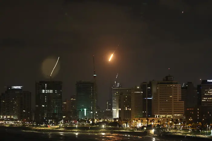 epa12178202 A missile fired from Iran breaches Israeli's 'Iron Dome' air defense system, as it strikes an area in Tel Aviv, Israel, 16 June 2025. Israel and Iran have been exchanging fire since Israel attacked on 13 June 2025 as part of Operation 'Rising Lion.' EPA/ATEF SAFADI