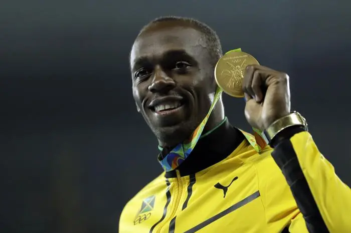 Gold medal winner Jamaica's Usain Bolt holds his medal after the award ceremony for the men's 200-meters during the athletics competitions of the 2016 Summer Olympics at the Olympic stadium in Rio de Janeiro, Brazil, Friday, Aug. 19, 2016. (ANSA/AP Photo/Jae C. Hong) [CopyrightNotice: Copyright 2016 The Associated Press. All rights reserved. This material may not be published, broadcast, rewritten or redistribu]