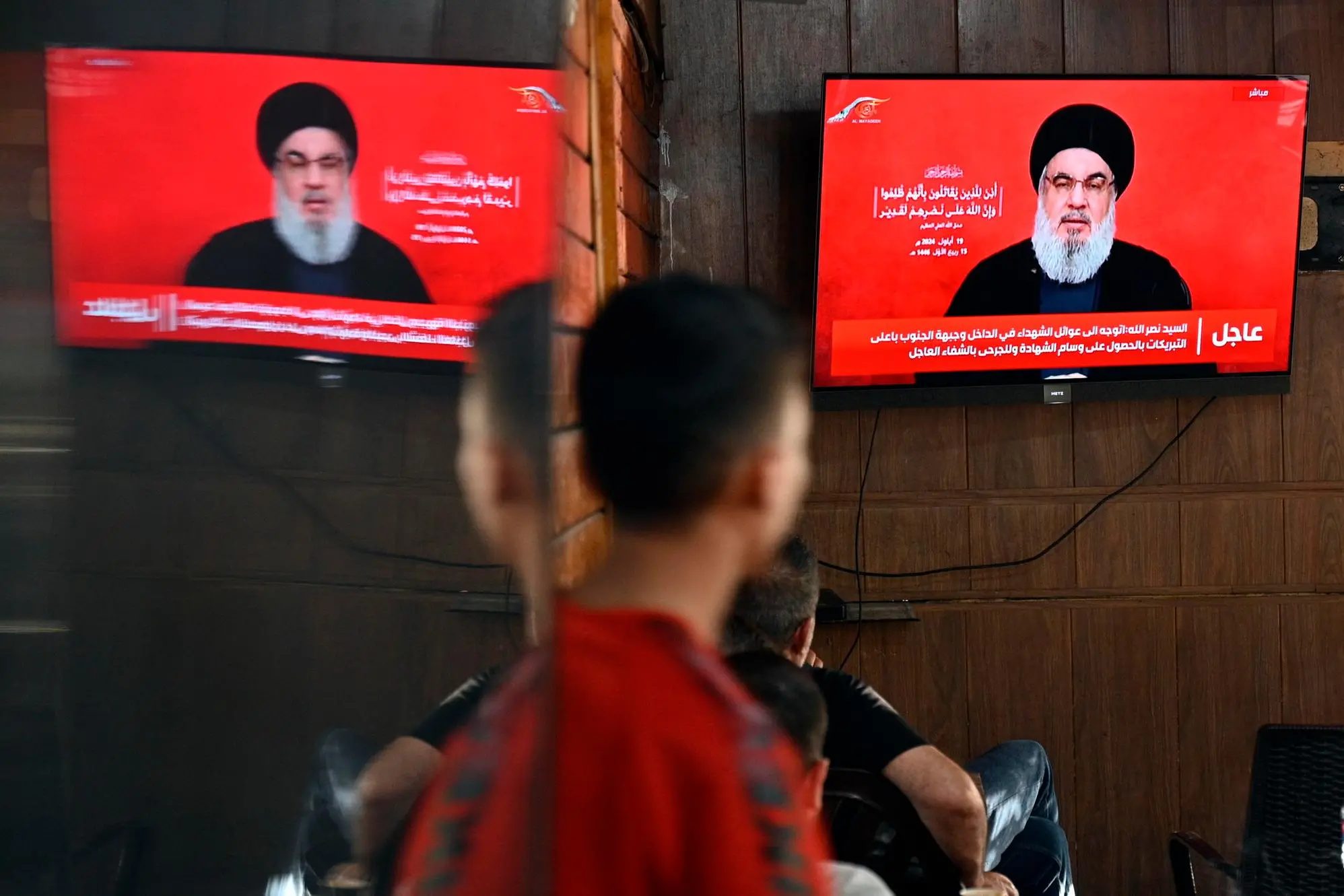 epa11614056 People watch Hezbollah Secretary-General Hassan Nasrallah delivering a televised speech at a coffee shop in the southern suburb of Beirut, Lebanon, 19 September 2024. Nasrallah commented on the explosions condemning Israel. Hezbollah declared in a statement that Israel was behind the strike and that there will be consequences. Lebanon's Health Minister Firas Abiad said on 19 September that at least 37 people died and more than 2900 others injured after multiple wireless communication devices were detonated on 17 and 18 September. EPA/WAEL HAMZEH